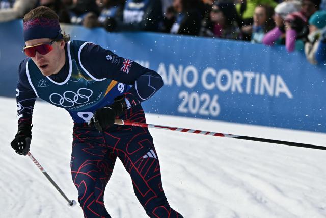 Britain's James Clugnet competes during the men's team cross country free sprint qualification event of the Milano Cortina 2026 Winter Olympic Games at Tesero Cross-Country Skiing Stadium in Lago di Tesero (Val di Fiemme), on February 18, 2026. (Photo by Javier SORIANO / AFP)