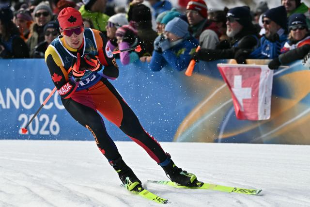 Canada's Xavier McKeever competes during the men's team cross country free sprint qualification event of the Milano Cortina 2026 Winter Olympic Games at Tesero Cross-Country Skiing Stadium in Lago di Tesero (Val di Fiemme), on February 18, 2026. (Photo by Javier SORIANO / AFP)
