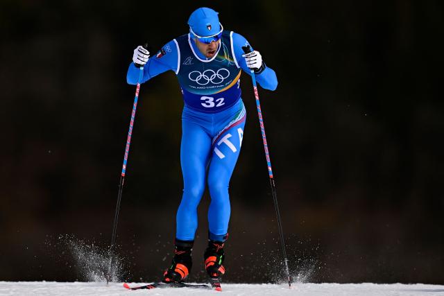 Italy's Federico Pellegrino competes during the men's team cross country free sprint qualification event of the Milano Cortina 2026 Winter Olympic Games at Tesero Cross-Country Skiing Stadium in Lago di Tesero (Val di Fiemme), on February 18, 2026. (Photo by Tobias SCHWARZ / AFP)