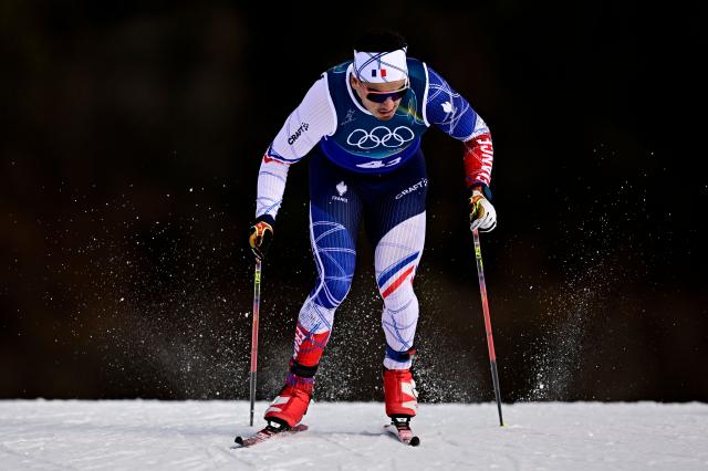 France's Jules Chappaz competes during the men's team cross country free sprint qualification event of the Milano Cortina 2026 Winter Olympic Games at Tesero Cross-Country Skiing Stadium in Lago di Tesero (Val di Fiemme), on February 18, 2026. (Photo by Tobias SCHWARZ / AFP)