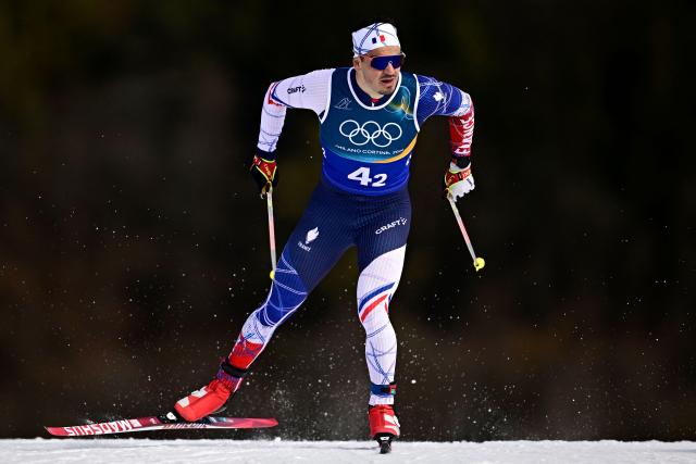 France's Jules Chappaz competes during the men's team cross country free sprint qualification event of the Milano Cortina 2026 Winter Olympic Games at Tesero Cross-Country Skiing Stadium in Lago di Tesero (Val di Fiemme), on February 18, 2026. (Photo by Tobias SCHWARZ / AFP)