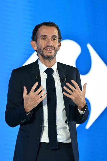 CEO of Carrefour Alexandre Bompard speaks during the presentation of Carrefour's new strategic plan at the company's headquarters in Massy, southern Paris suburbs, on February 18, 2026. (Photo by Bertrand GUAY / AFP)