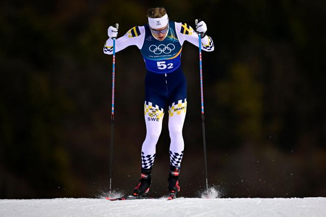 Sweden's Edvin Anger competes during the men's team cross country free sprint qualification event of the Milano Cortina 2026 Winter Olympic Games at Tesero Cross-Country Skiing Stadium in Lago di Tesero (Val di Fiemme), on February 18, 2026. (Photo by Tobias SCHWARZ / AFP)