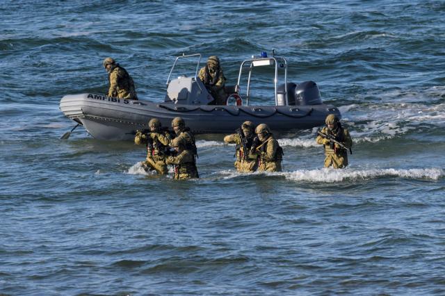 Soldiers take part in NATO's STEADFAST DART 26 exercise in Putlos, Germany, on February 18, 2026. (Photo by Fabian Bimmer / POOL / AFP)