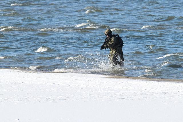 A soldier takes part in NATO's STEADFAST DART 26 exercise in Putlos, Germany, on February 18, 2026. (Photo by Fabian Bimmer / POOL / AFP)