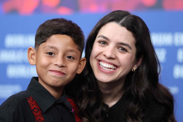 Mexican child actor Bastian Escobar and Mexican co-Producer Erendira Nunez Larios pose after a press conference for the film "Moscas" (Flies) presented in competition at the 76th Berlinale, Europe's first major film festival of the year, in Berlin on February 18, 2026. (Photo by Ronny HARTMANN / AFP)