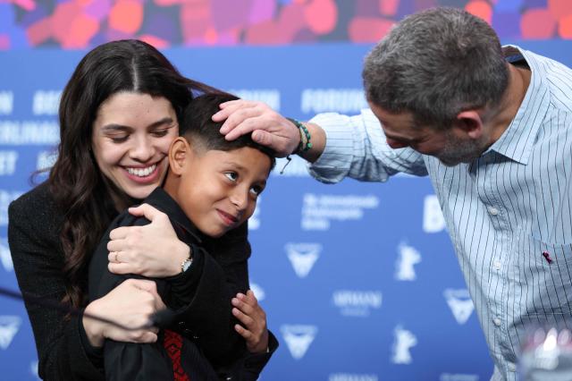 Mexican child actor Bastian Escobar (C) and Mexican co-Producer Erendira Nunez Larios (L) and Mexican director Fernando Eimbcke joke after a press conference for the film "Moscas" (Flies) presented in competition at the 76th Berlinale, Europe's first major film festival of the year, in Berlin on February 18, 2026. (Photo by Ronny HARTMANN / AFP)