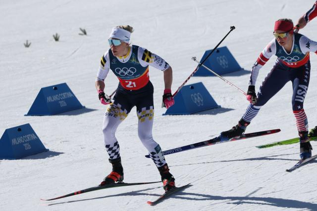 Sweden's Jonna Sundling (L) and USA's Jessie Diggins compete during the women's team cross country free sprint final event of the Milano Cortina 2026 Winter Olympic Games at Tesero Cross-Country Skiing Stadium in Lago di Tesero (Val di Fiemme), on February 18, 2026. (Photo by Anne-Christine POUJOULAT / AFP)