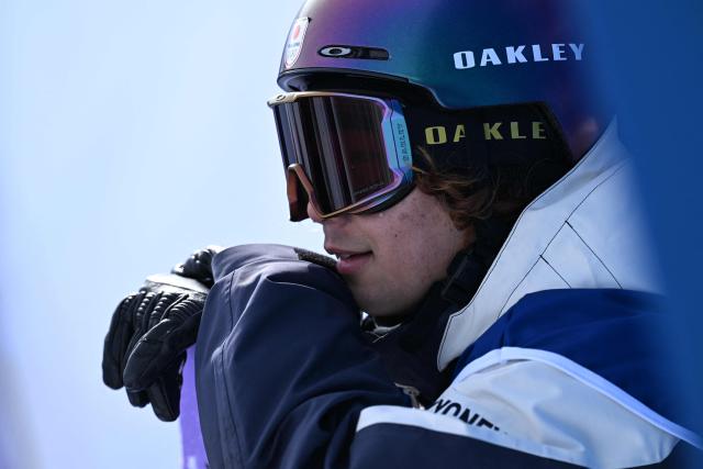 Japan's Taiga Hasegawa waits for his score after competing in the snowboard men's slopestyle final run 2 during the Milano Cortina 2026 Winter Olympic Games at Livigno Snow Park, in Livigno (Valtellina), on February 18, 2026. (Photo by Kirill KUDRYAVTSEV / AFP)