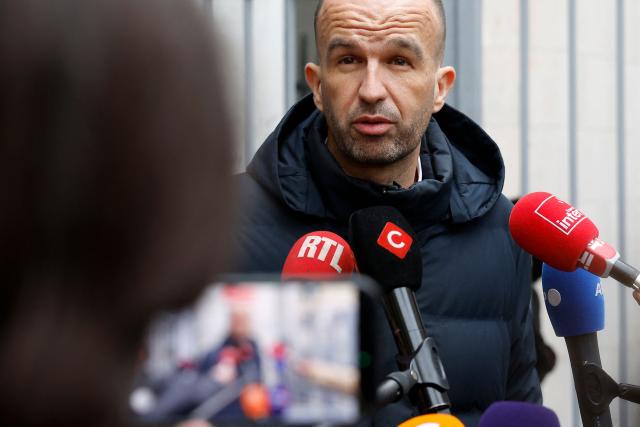 French leftist party La France Insoumise (LFI) coordinator Manuel Bompard talks to the press outside the party's headquarters after its evacuation following a "bomb threat", as LFI is accused by its political opponents of partial responsibility in the killing of a far-right activist, in Paris on February 18, 2026. Quentin Deranque, 23, died after sustaining a severe brain injury when he was attacked by at least six people last week on the sidelines of a far-right protest against a LFI politician speaking at a university in the southeastern city of Lyon. The incident has fuelled tension between France's far right and hard left ahead of municipal elections in March and the 2027 presidential race. (Photo by Charlotte SIEMON / AFP)