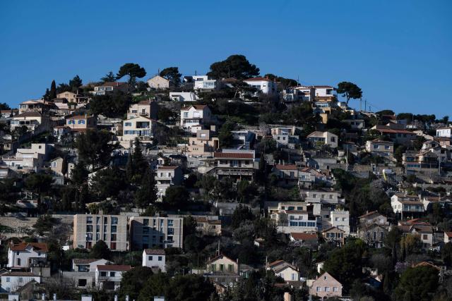 This photograph shows houses at the Le Verduron neighbourhood in northern Marseille on February 17, 2026. (Photo by MIGUEL MEDINA / AFP)