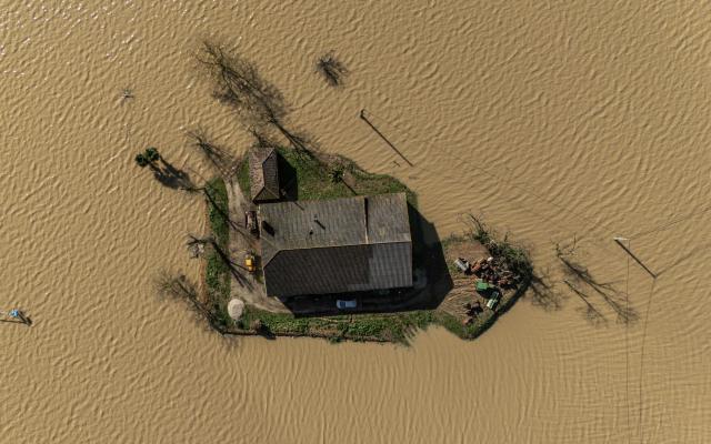 A general view shows floodwater surrounding houses in Saint-Pardoux-du-Breuil, near Marmande, in the Lot-and-Garonne department of southwestern France on February 18, 2026. (Photo by Ed JONES / AFP)