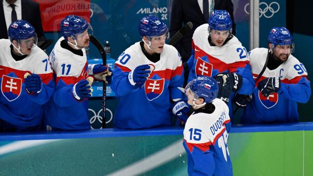 Slovakia's #15 Dalibor Dvorsky celebrates scoring his team's fourth goal with teammates during the men's play-off quarter-final ice hockey match between Slovakia and Germany at the Milano Santagiulia Ice Hockey Arena during the Milano Cortina 2026 Winter Olympic Games in Milan, on February 18, 2026. (Photo by Alexander NEMENOV / AFP)