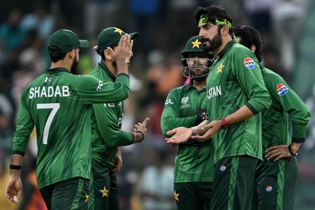 Pakistan's Usman Tariq (R) celebrates with teammates after taking the wicket of Namibia's Ruben Trumpelmann during the 2026 ICC Men's T20 Cricket World Cup group stage match between Pakistan and Namibia at the Sinhalese Sports Club (SSC) Ground in Colombo on February 18, 2026. (Photo by Ishara S. KODIKARA / AFP)