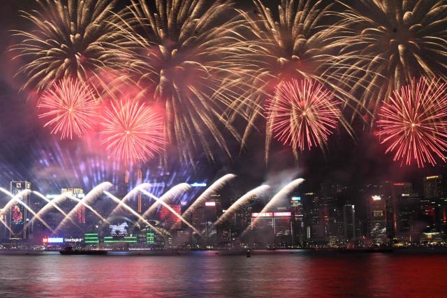 Fireworks light up the sky over Victoria Harbour on second day of the Lunar New Year of the Horse, in Hong Kong on February 18, 2026. (Photo by Peter PARKS / AFP)