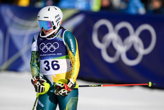 Australia's Madison Hoffman reacts in the finish area of the second run of the women's slalom event during the Milano Cortina 2026 Winter Olympic Games at the Tofane Alpine Skiing Centre in Cortina d’Ampezzo on February 18, 2026. (Photo by Marco BERTORELLO / AFP)