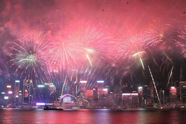Fireworks light up the sky over Victoria Harbour on second day of the Lunar New Year of the Horse, in Hong Kong on February 18, 2026. (Photo by Peter PARKS / AFP)