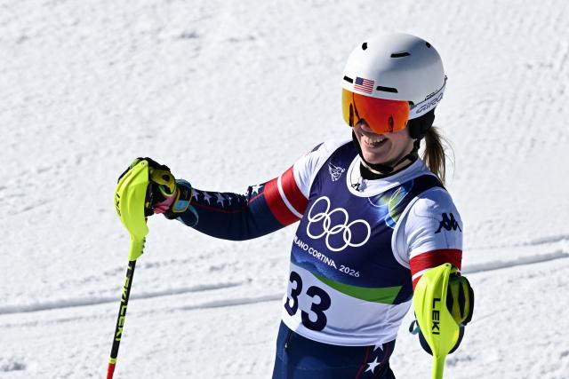 USA's A J Hurt reacts in the finish area after competing in the second run of the women's slalom event during the Milano Cortina 2026 Winter Olympic Games at the Tofane Alpine Skiing Centre in Cortina d’Ampezzo on February 18, 2026. (Photo by Tiziana FABI / AFP)