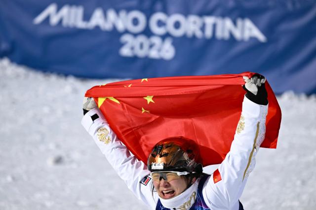 China's Xu Mengtao reacts as she wins the freestyle skiing women's aerials final during the Milano Cortina 2026 Winter Olympic Games at Livigno Aerials & Moguls Park, in Livigno (Valtellina), on February 18, 2026. (Photo by Jeff PACHOUD / AFP)