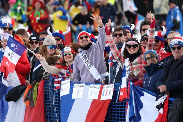 France fans cheer before the start of the women's biathlon 4x6km relay event during the Milano Cortina 2026 Winter Olympic Games at the Anterselva Biathlon Arena (Sudtirol Arena) in Anterselva (Val Pusteria) on February 18, 2026. (Photo by Odd ANDERSEN / AFP)
