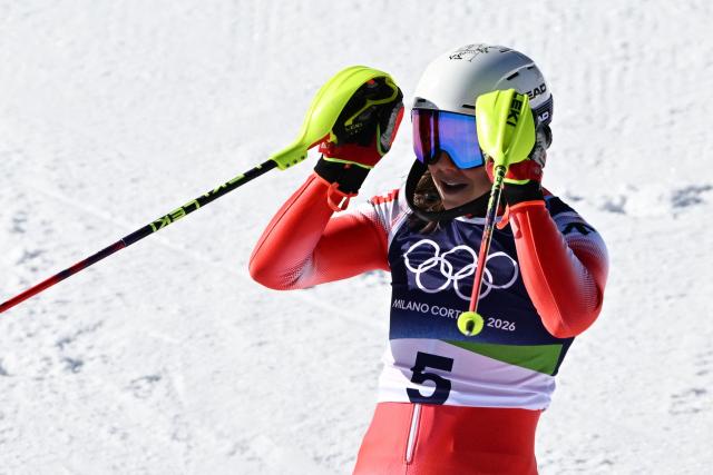 Switzerland's Wendy Holdener reacts in the finish area after competing in the second run of the women's slalom event during the Milano Cortina 2026 Winter Olympic Games at the Tofane Alpine Skiing Centre in Cortina d’Ampezzo on February 18, 2026. (Photo by Tiziana FABI / AFP)