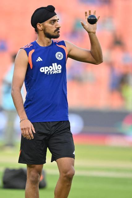 India's Arshdeep Singh gestures as he warms up before the start of the 2026 ICC Men's T20 Cricket World Cup group stage match between India and Netherlands at the Narendra Modi Stadium in Ahmedabad on February 18, 2026. (Photo by Shammi MEHRA / AFP)