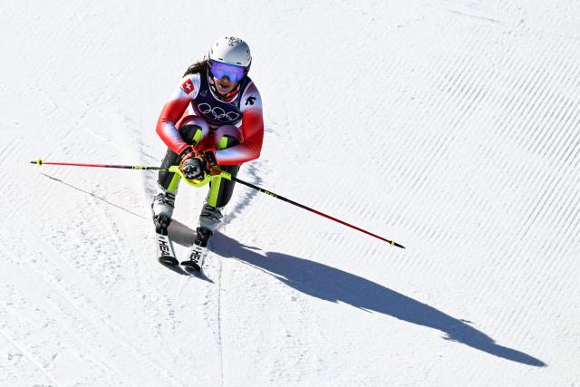 Switzerland's Wendy Holdener reacts in the finish area after competing in the second run of the women's slalom event during the Milano Cortina 2026 Winter Olympic Games at the Tofane Alpine Skiing Centre in Cortina d’Ampezzo on February 18, 2026. (Photo by Tiziana FABI / AFP)