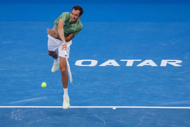 Russia’s Daniil Medvedev serves the ball against Greece's Stefanos Tsitsipas during their men’s singles match at the Qatar Open tennis tournament in Doha on February 18, 2026. (Photo by Karim JAAFAR / AFP)