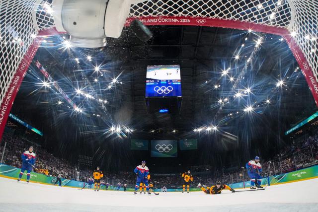 Slovakia's #90 Tomas Tatar scores his team's sixth goal during the men's play-off quarter-final ice hockey match between Slovakia and Germany at the Milano Santagiulia Ice Hockey Arena during the Milano Cortina 2026 Winter Olympic Games in Milan, on February 18, 2026. (Photo by POOL / AFP)