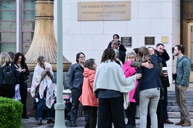 Attendees wait to enter the Los Angeles Superior Court in Los Angeles, on February 18, 2026. Meta CEO Mark Zuckerberg is scheduled to testify in the social media trial tasked to determine whether social media giants deliberately designed their platforms to be addictive to children. (Photo by Frederic J. Brown / AFP)