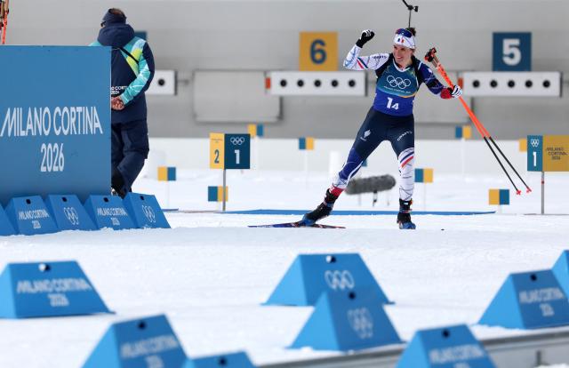 France's Julia Simon gestures while approaching the finish line in the women's biathlon 4x6km relay event during the Milano Cortina 2026 Winter Olympic Games at the Anterselva Biathlon Arena (Sudtirol Arena) in Anterselva (Val Pusteria) on February 18, 2026. (Photo by Odd ANDERSEN / AFP)