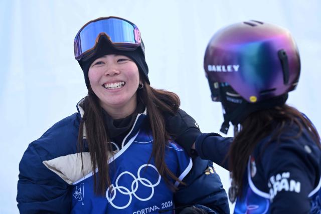 Japan's Mari Fukada and Japan's Kokomo Murase react in the snowboard women's slopestyle final run 3 during the Milano Cortina 2026 Winter Olympic Games at Livigno Snow Park, in Livigno (Valtellina), on February 18, 2026. (Photo by Kirill KUDRYAVTSEV / AFP)