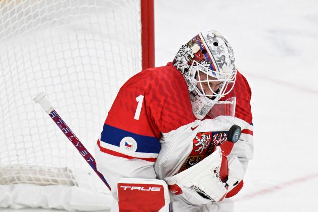 Czech Republic's goalkeeper #01 Lukas Dostal makes a save during the men's play-off quarter-final ice hockey match between Canada and Czech Republic at the Milano Santagiulia Ice Hockey Arena during the Milano Cortina 2026 Winter Olympic Games in Milan, on February 18, 2026. (Photo by Alexander NEMENOV / AFP)