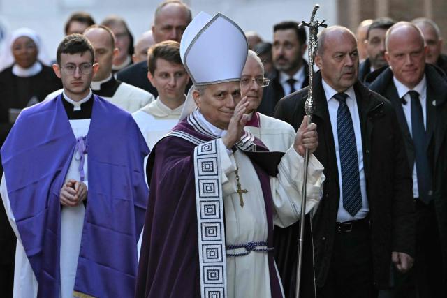 Pope Leo XIV attends a penitential procession outside the Church of Saint Anselm on the Aventine Hill in Rome before a holy mass on Ash Wednesday at the Basilica of Saint Sabina, on February 18, 2026. (Photo by Andreas SOLARO / AFP)