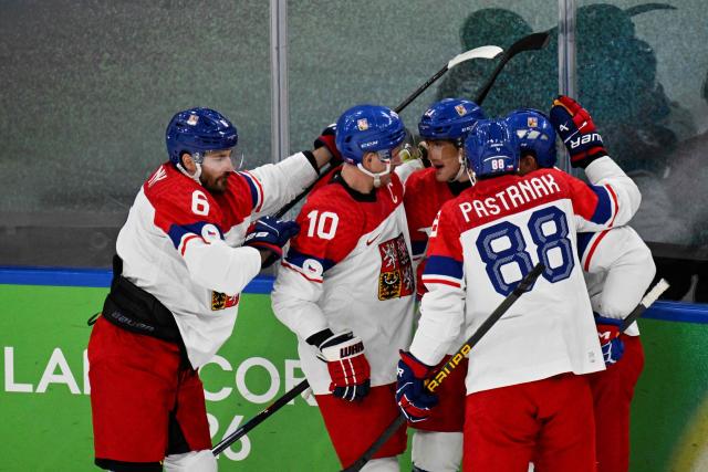 Czech Republic's #23 Lukas Sedlak (C) celebrates with teammates after scoring his team's first goal during the men's play-off quarter-final ice hockey match between Canada and Czech Republic at the Milano Santagiulia Ice Hockey Arena during the Milano Cortina 2026 Winter Olympic Games in Milan, on February 18, 2026. (Photo by Alexander NEMENOV / AFP)