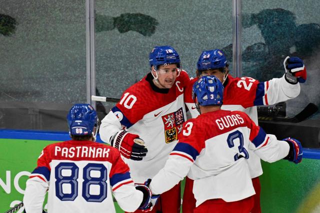 Czech Republic's #23 Lukas Sedlak (C) celebrates with teammates after scoring his team's first goal during the men's play-off quarter-final ice hockey match between Canada and Czech Republic at the Milano Santagiulia Ice Hockey Arena during the Milano Cortina 2026 Winter Olympic Games in Milan, on February 18, 2026. (Photo by Alexander NEMENOV / AFP)