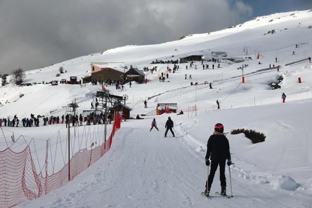 People ski at the Val d'Ese ski resort in Bastelica 50 km from Ajaccio on the French Mediterranean island of Corsica.on February 15, 2026. The Val d’Ese ski resort, standing 1,620 meters high, is one of the few ski resorts in France where people can ski with a view of the sea. (Photo by Pascal POCHARD-CASABIANCA / AFP)