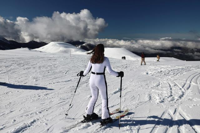 People ski at the Val d'Ese ski resort in Bastelica 50 km from Ajaccio on the French Mediterranean island of Corsica.on February 15, 2026. The Val d’Ese ski resort, standing 1,620 meters high, is one of the few ski resorts in France where people can ski with a view of the sea. (Photo by Pascal POCHARD-CASABIANCA / AFP)