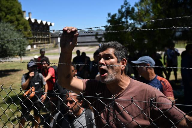 Workers of Argentine tyre company Fate gather during a protest against the announcement of the company's closure and the dismissal of more than 900 employees, in Virreyes, Buenos Aires province, Argentina on February 18, 2026. Argentina's leading tyre manufacturer, announced it would be closing down permanently attributing the decision to a decline in competitiveness in the context of increased imports. The closure of Fate, founded more than 80 years ago and with the capacity to produce some 5 million tyres annually, adds to that of more than 21,000 companies in the last two years and the loss of some 300,000 jobs, according to union sources. (Photo by Luis ROBAYO / AFP)