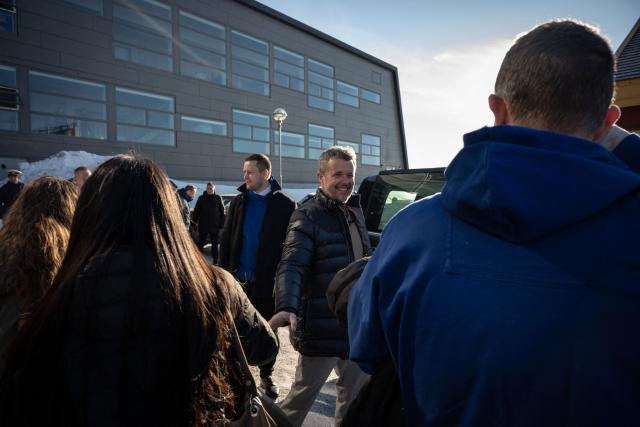 Denmark’s King Frederik X greets residents in Nuuk, Greenland, on February 18, 2026. (Photo by Florent VERGNES / AFP)