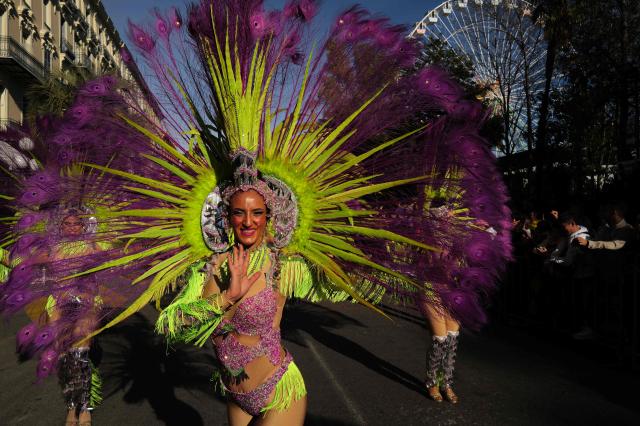 Artist perform during the Flower parade, as part the 141st edition of the Nice Carnival in the French Riviera City of Nice on February 18, 2026. The edition 2026 of the Carnival called "Long live the Queen! will take place until March 1, 2026. (Photo by Valery HACHE / AFP)