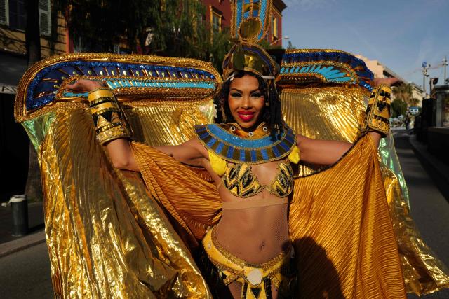 An artist performs during the Flower parade, as part the 141st edition of the Nice Carnival in the French Riviera City of Nice on February 18, 2026. The edition 2026 of the Carnival called "Long live the Queen! will take place until March 1, 2026. (Photo by Valery HACHE / AFP)