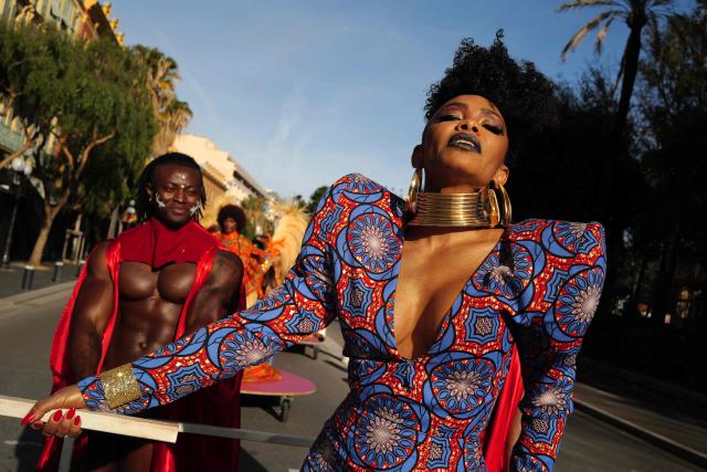 Artists perform during the Flower parade, as part the 141st edition of the Nice Carnival in the French Riviera City of Nice on February 18, 2026. The edition 2026 of the Carnival called "Long live the Queen! will take place until March 1, 2026. (Photo by Valery HACHE / AFP)