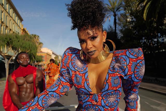 Artists perform during the Flower parade, as part the 141st edition of the Nice Carnival in the French Riviera City of Nice on February 18, 2026. The edition 2026 of the Carnival called "Long live the Queen! will take place until March 1, 2026. (Photo by Valery HACHE / AFP)