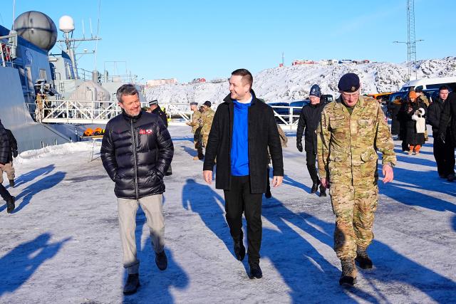 Denmark's King Frederik X and Greenland's Prime Minister Jens-Frederik Nielsen (C) visit Arctic Basic Training and Arctic Command in Nuuk, Greenland, on February 18, 2026. Denmark's King Frederik X arrived in Greenland for a three-day visit in a show of support for the autonomous Danish territory coveted by US President Donald Trump. (Photo by Bo Amstrup / Ritzau Scanpix / AFP) / Denmark OUT