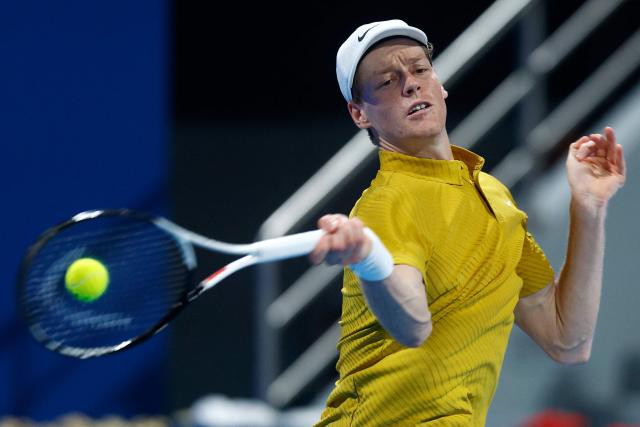 Italy's Jannik Sinner hits a return against Australia's Alexei Popyrin during their men’s singles match at the Qatar Open tennis tournament in Doha on February 18, 2026. (Photo by Karim JAAFAR / AFP)