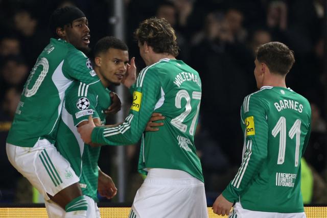 Newcastle United's German defender #12 Malick Thiaw celebrates with teammates after scoring the team's second goal during the UEFA Champions League knockout phase play-off first leg football match between Qarabag and Newcastle at the Tofiq Bahramov Republican Stadium in Baku on February 18, 2026. (Photo by Giorgi ARJEVANIDZE / AFP)