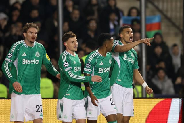 Newcastle United's German defender #12 Malick Thiaw celebrates with teammates after scoring the team's second goal during the UEFA Champions League knockout phase play-off first leg football match between Qarabag and Newcastle at the Tofiq Bahramov Republican Stadium in Baku on February 18, 2026. (Photo by Giorgi ARJEVANIDZE / AFP)