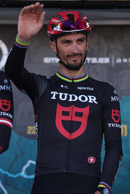 Tudor Pro Cycling Team's French cyclist Julian Alaphilippe waves during the team presentation, ahead of the first stage of the 52nd edition of the Volta ao Algarve, a 183.5 km race between Vila Real de Santo Antonio and Tavira on February 18, 2026. (Photo by João Matos / AFP)