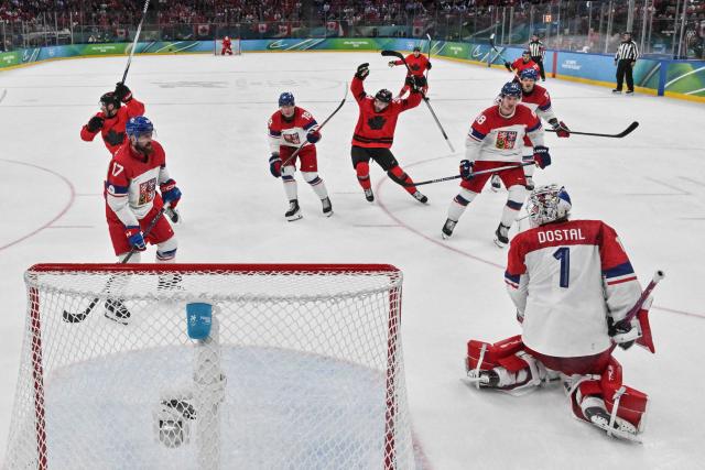Czech Republic's goalkeeper #01 Lukas Dostal reacts after missing to stop Canada's third goal scored by Canada's #10 Nick Suzuki during the men's play-off quarter-final ice hockey match between Canada and Czech Republic at the Milano Santagiulia Ice Hockey Arena during the Milano Cortina 2026 Winter Olympic Games in Milan, on February 18, 2026. (Photo by Alexander NEMENOV / POOL / AFP)